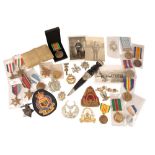 A COLLECTION OF CAP BADGES & MEDALS