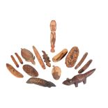 A GROUP OF WOODEN ABORIGINAL ARTIFACTS AND ASSORTED FIGURES