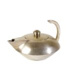 IN THE MANNER OF THE BAUHAUS SCHOOL: A SILVER PLATED TEAPOT