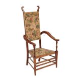 J.S HENRY: AN ARTS AND CRAFTS WALNUT FRAMED ARMCHAIR