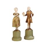 FERDINAND PREISS (1882 - 1943) : A PAIR OF GILT COLD PAINTED BRONZE AND IVORY FIGURES