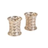 OMAR RAMSDEN & ALWYN CARR: A PAIR OF EDWARDIAN SILVER NAPKIN RINGS