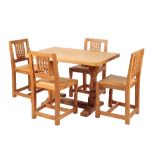 ROBERT THOMPSON "MOUSEMAN": AN OAK DINING TABLE AND FOUR CHAIRS
