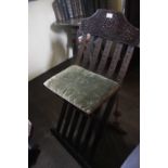 A RENAISSANCE STYLE FOLDING CHAIR