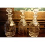 A PAIR OF LATE REGENCY CUT-GLASS DECANTERS AND STOPPERS