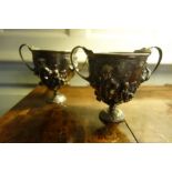 A PAIR OF ROMAN STYLE SILVERED METAL CUPS