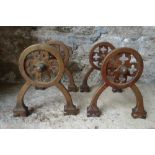 A PAIR OF GOTHIC STYLE BRASS IMPLEMENT RESTS