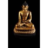 FINE GILT-BRONZE FIGURE OF BUDDHA SHAKYAMUNI, TIBET, 15TH CENTURY