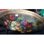 A LARGE OVAL PLAQUE DECORATED WITH A STILL LIFE OF FLOWERS, 103cm wide