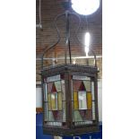 A VICTORIAN HALL LANTERN with stained glass panels