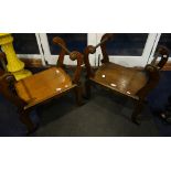 A PAIR OF OAK AND COPPER SOLID SEAT 'SEDILIA' OR STOOLS, with scrolling legs and upstands supporting