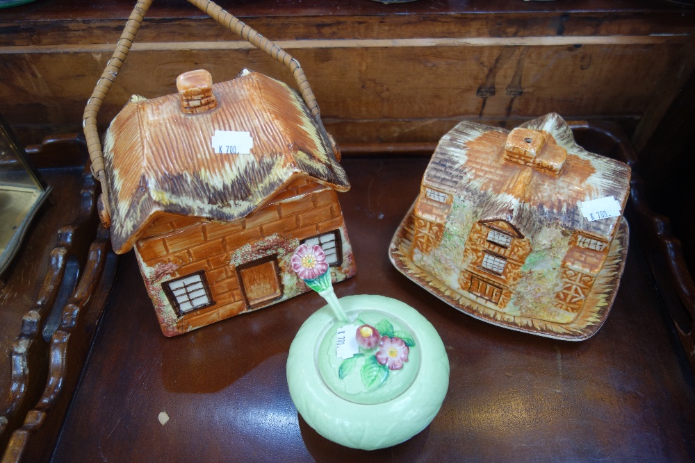 A COTTAGE WARE BISCUIT BARREL, a similar cheese dish and a Carltonware jam pot with spoon (3)