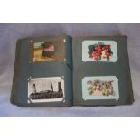 A COLLECTION OF EDWARDIAN AND LATER POSTCARDS in a fitted album