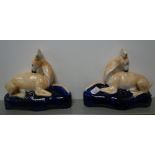 A PAIR OF STAFFORDSHIRE PEN STANDS, in the form of deer on Royal blue bases