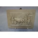 A MINIATURE STONE CARVED PLAQUE of a farm scene, 11cm x 8cm