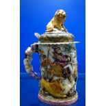 A CONTINENTAL 'DOCCIA' STYLE CERAMIC LIDDED TANKARD or stein, decorated with lions and hunters on