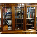 A REPRODUCTION GEORGE III STYLE MAHOGANY GLAZED BOOKCASE by Brights, 158cm wide