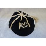 A VELVET SPORTING CAP, embroidered 'BSFA 1925-26'