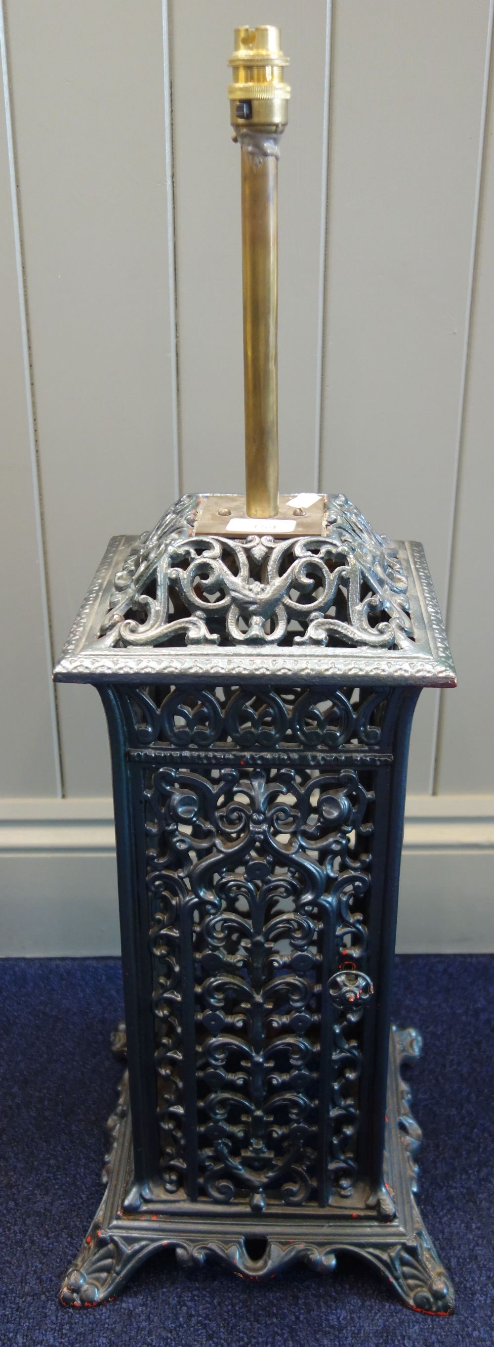 A VICTORIAN CAST IRON CONSERVATORY HEATER (converted to a lamp)