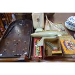 A COLLECTION OF VINTAGE CHILDREN'S TOYS AND GAMES, to include a bagatelle, a tin plate top loading