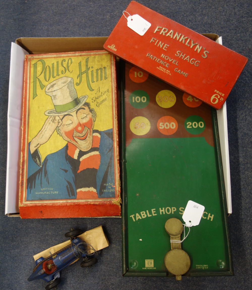 A VINTAGE 'ROUSE HIM' SHOOTING GAME (boxed), a tinplate table hopscotch and a Schuco racing car (