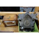 A BLACK FOREST CUCKOO CLOCK and a 1930s oak cased mantel clock