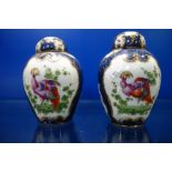 A PAIR OF WORCESTER STYLE (SAMPSON?) LIDDED VASES with blue and gilt decoration, the panels