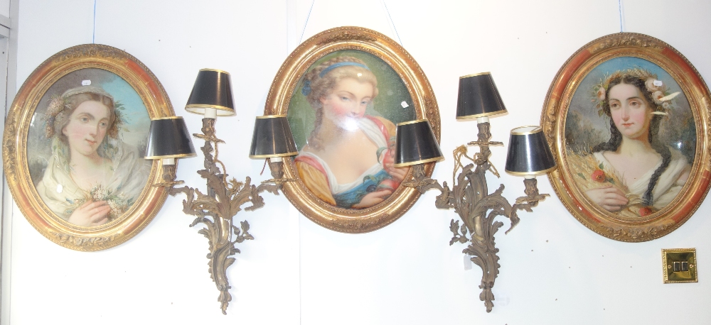 THREE 19TH CENTURY REVERSE PAINTINGS ON OVAL CONVEX GLASS, each of differing seasons in gilt frames,