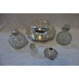 TWO VICTORIAN SILVER TOPPED AND CUT GLASS SCENT BOTTLES and a Victorian silver plated muffin dish