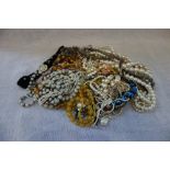 A COLLECTION OF BEADED JEWELLERY, to include a simulated pearl necklace