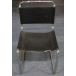 MARCEL BREUER/MATT STRAM: A single chrome framed cantilever chair with black leather seat and back