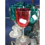 A COLLECTION OF VICTORIAN GREEN GLASSES and a cranberry glass