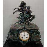A 19TH CENTURY SPELTER MANTEL CLOCK decorated with a study of a horse with a figure, 41cm high