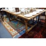 A LARGE PINE REFECTORY TABLE, on turned legs with H stretcher, 118cm x 212cm