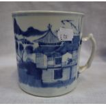 A CHINESE EXPORT BLUE AND WHITE MUG, painted with a conventional landscape