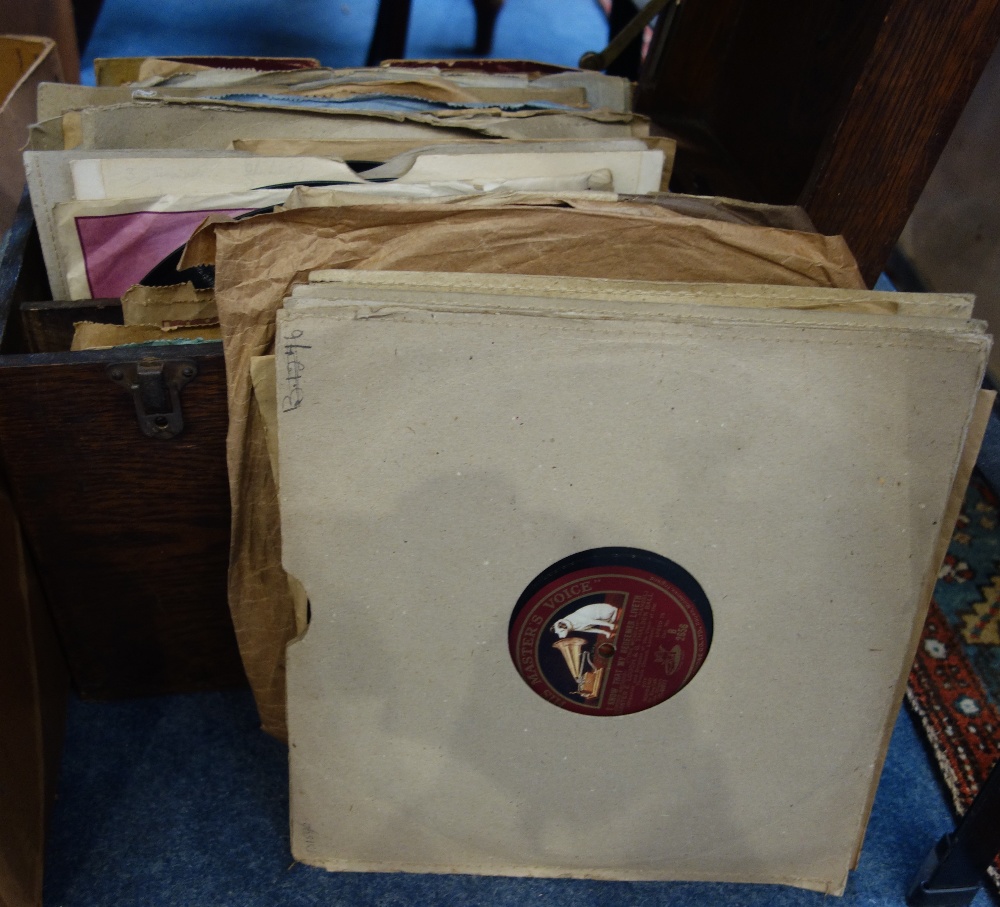 A COLLECTION OF VINTAGE 78rpm RECORDS contained in an oak case