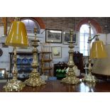 A PAIR OF ROCOCCO BRASS TABLE LAMPS and a similar pair with orange glass shades