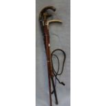 A HORN HANDLED RIDING CROP with silver ferrules and two walking sticks