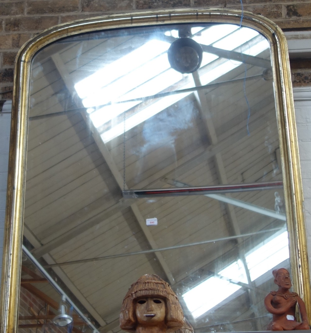 A VICTORIAN GILT FRAMED OVERMANTLE MIRROR of arched form, 110cm wide 130cm high