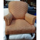 A 1920'S UPHOLSTERED ARMCHAIR, with tapered oak legs