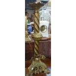 A LARGE BRASS ALTAR CANDLESTICK (converted to a table lamp) 77cm high (plus fitting)