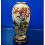 A JAPANESE SATSUMA VASE, MARKED, painted and gilt, 15 cm high, with wooden stand
