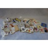A COLLECTION OF CIGARETTE CARDS and medal ribbons