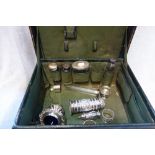 A LATE 19TH CENTURY LEATHER VANITY CASE, containing four silver topped dressing table bottles, an