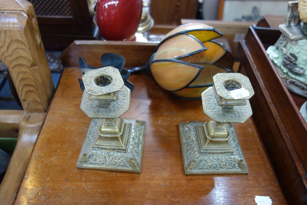 A PAIR OF VICTORIAN BRASS CANDLESTICKS and an Art Nouveau style wall light