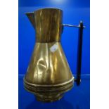 AN ARTS & CRAFTS BRASS JUG with a bog-oak handle, 24cm high