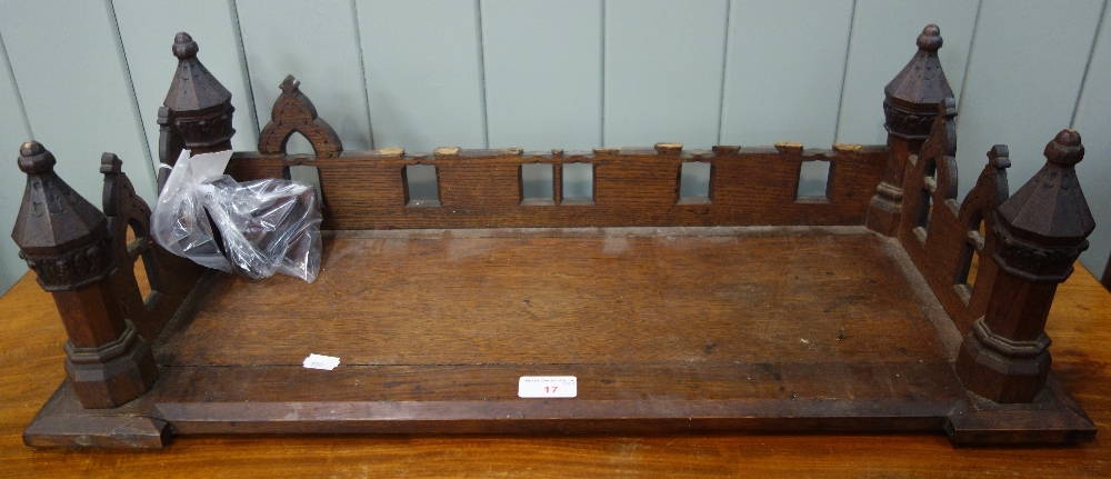 A VICTORIAN GOTHIC OAK BOOK RACK, 67.5cm wide