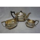 A SILVER THREE PIECE TEA SET, by William Hutton & Sons, Sheffield, 1933, comprising milk jug,