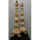 A 19TH CENTURY CONTINENTAL ALTAR CANDLESTICK with gesso and gilt decoration, 64cm high (plus