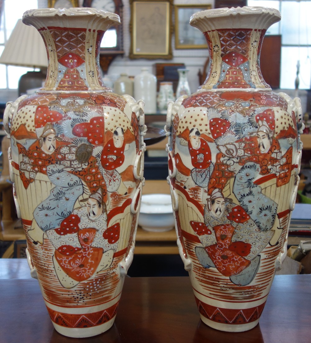 A PAIR OF LARGE JAPANESE VASES decorated with warriors, 49.5cm high